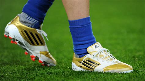 pictures of messi soccer shoes.